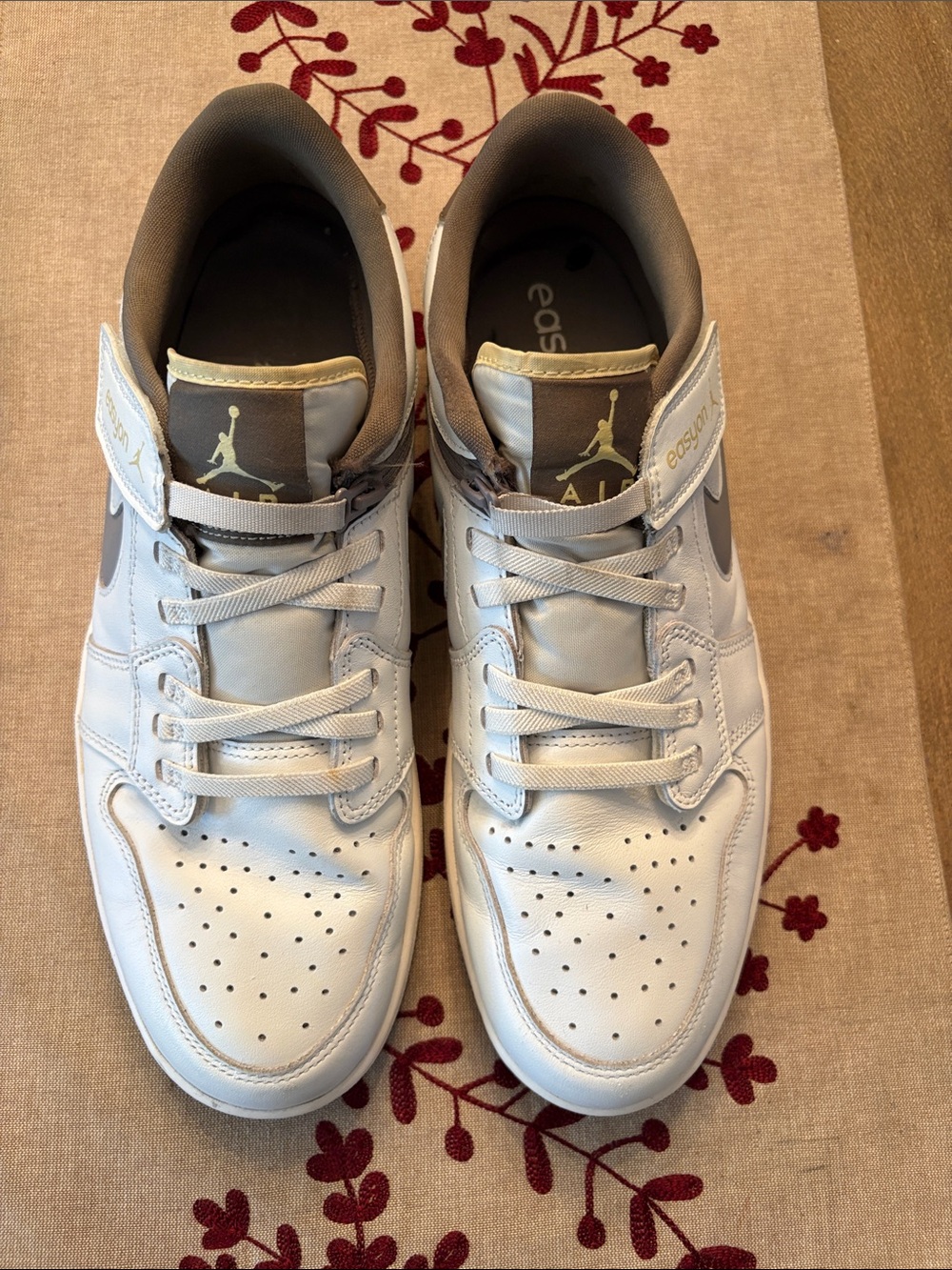 Nike Air Jordan Mid-Top Sneakers in White and khaki Grey accent. Easy on style
